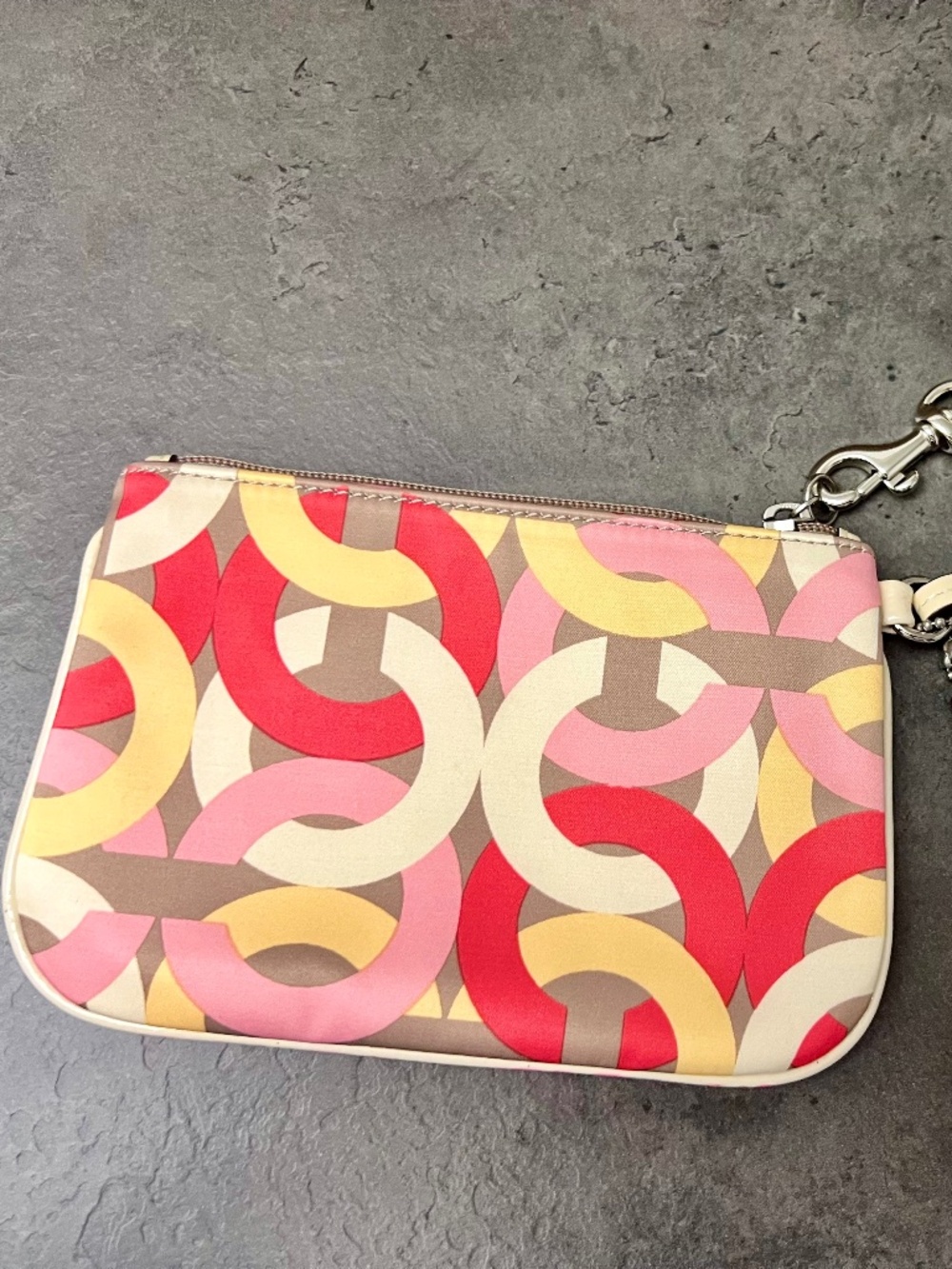 NWOT - Coach - corner zip wristlet. Multicolored chain print.